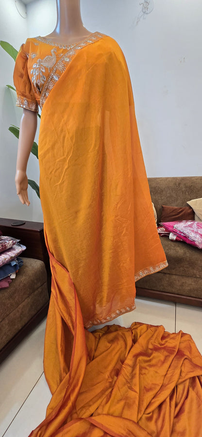 Vichitra Fabric Orange colored saree with puffed peacock design ready blouse