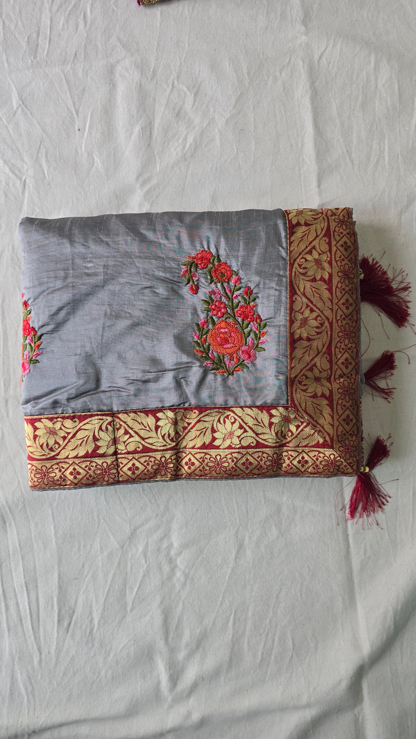 Metallic silver silk saree with contrast readymade embroidered blouse